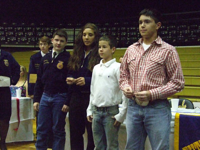 Image: Allysa gives awards — Alyssa Richards is a new officer for the FFA and gives the Greenhand Awards to students (L-R) Jake Escamilla, (Alyssa), Marcus Surles and Brandon Jacinto.
