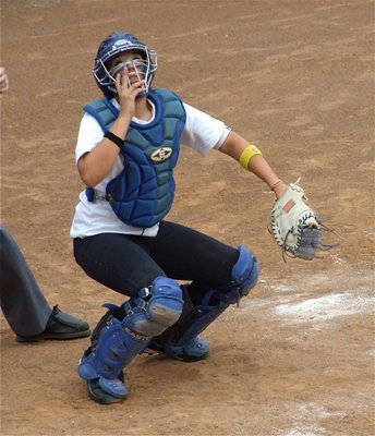 Image: Alyssa reacts — Catcher Alyssa Richards looks up searching for a foul ball popped up by Meridian.