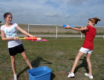 Image: Having Too Much Fun — Cassidy Childers and Halee Turner are both sixth graders ready and willing to help the kids play Duck Duck Squirt.