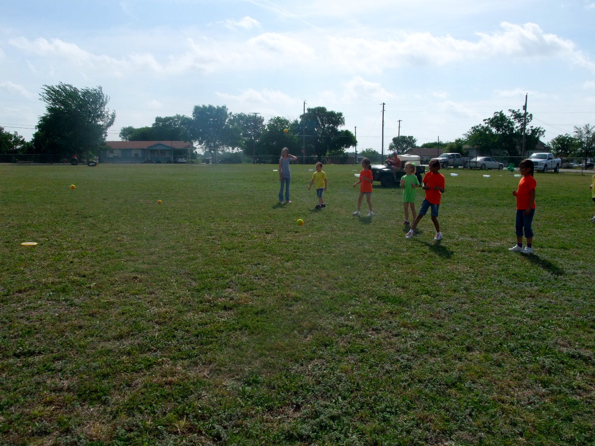 Image: They are playing Target Frisbee — Watch out for flying balls.