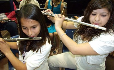 Image: Flute duo  — 7th grade Flute specialists Ana Luna and Juanita Garcia play in perfect harmony.