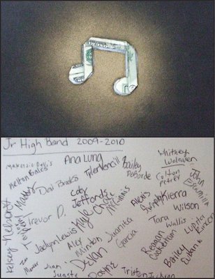 Image: A c-note — The 7th grade band members presented IHS Band Director Jesus Perez with a c-note. Well, it’s really an eighth note cleverly made in origami by IHS teacher Michael Destefani using a $100 bill. Band members also signed the back of the card.