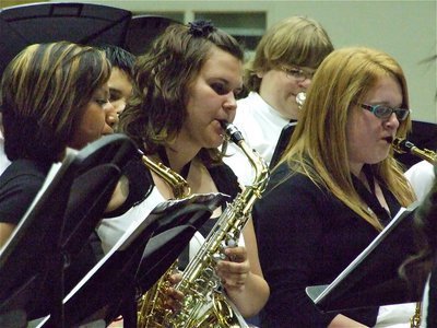 Image: Making music — Gladiator Regiment Band members Jessica Hernandez, Megan Buchanan, Logan Owens and Emily Stiles blare their alto saxophones during the Spring Concert held inside the Italy Coliseum Dome.