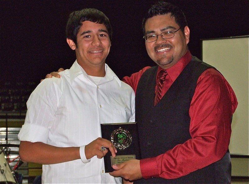 Image: Congrats, Taz! — Gladiator Regiment Band member Taz Martinez receives the Patrick Gilmore Award from Mr. Perez.