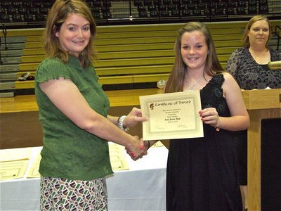 Image: Reagan Cockerham — Reagan Cockerham is honored with a Certificate of Award from IHS Principal Tanya Parker for citizenship in Social Studies.