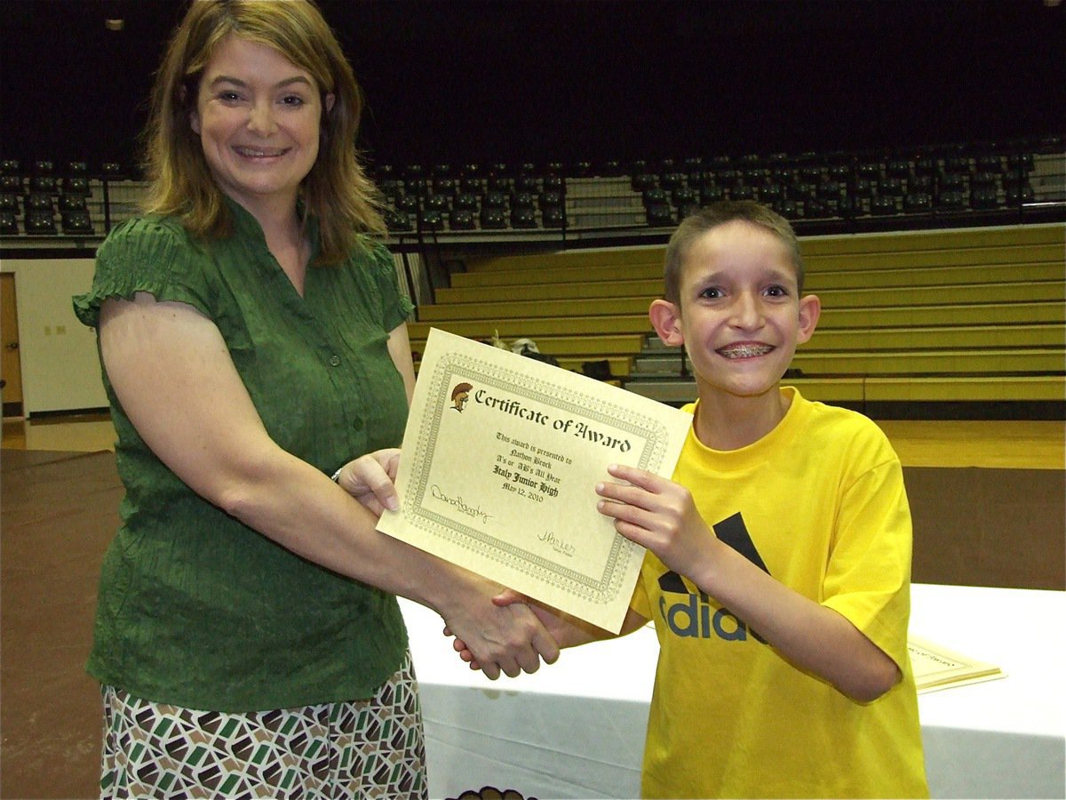 Image: Nathon Brock — Nathon Brock who, by far, received the loudest applause from his peers is honored with a Certificate of Award from IHS Principal Tanya Parker for receiving all A’s or AB’s all year.