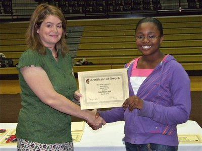 Image: Kierra Wilson — Kierra Wilson is honored with a Certificate of Award from IHS Principal Tanya Parker for Highest Average in English.