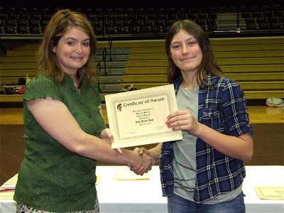 Image: Whitney Wolaver — Whitney Wolaver is honored with a Certificate of Award from IHS Principal Tanya Parker for Hardest Working in Mathematics.