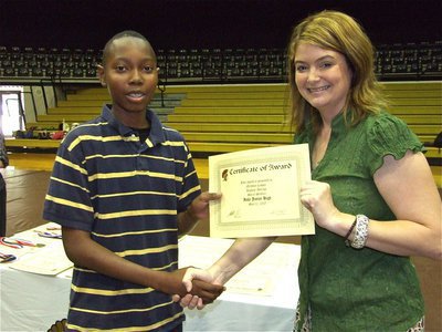 Image: Nicholas Cooper — Nicholas Cooper is honored with a Certificate of Award from IHS Principal Tanya Parker for Highest Average in Social Studies.