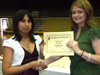 Image: Wendy Davila — Wendy Davila is honored with a Certificate of Award from IHS Principal Tanya Parker for Hardest Working in Science.