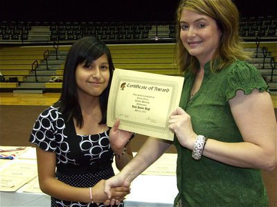 Image: Jessica Garcia — Jessica Garcia is honored with a Certificate of Award from IHS Principal Tanya Parker for Hardest Working in Mathematics.