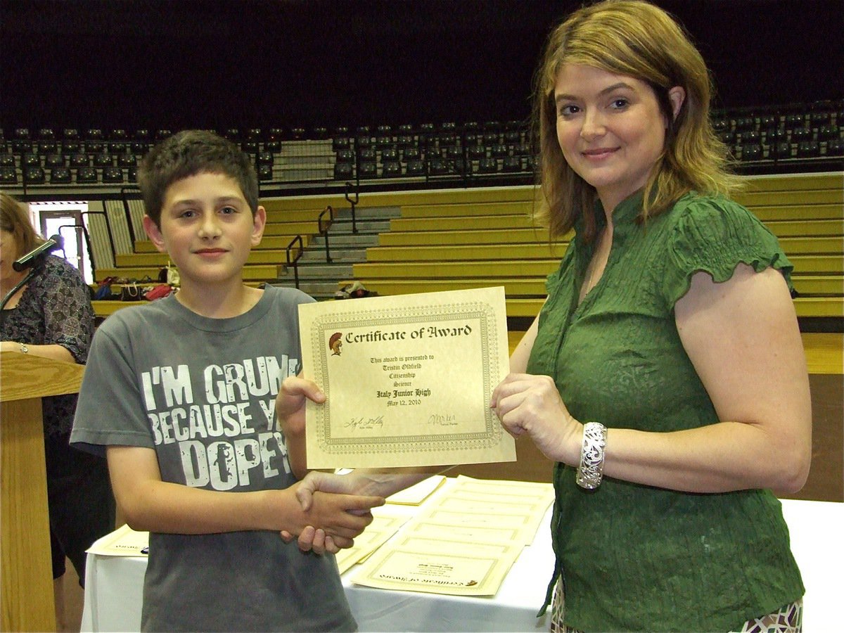 Image: Tristin Oldfield — Tristin Oldfield is honored with a Certificate of Award from IHS Principal Tanya Parker for Citizenship in Science.