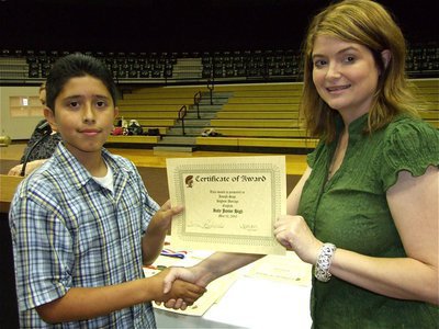 Image: Joseph Sage — Joseph Sage is honored with a Certificate of Award from IHS Principal Tanya Parker for Highest Average in English.