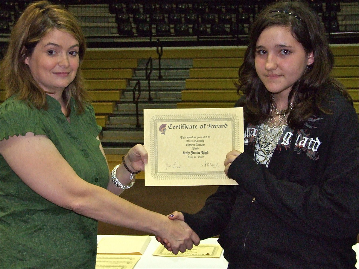 Image: Alexis Sampley — Alexis Sampley is honored with a Certificate of Award from IHS Principal Tanya Parker for Highest Average in Band.