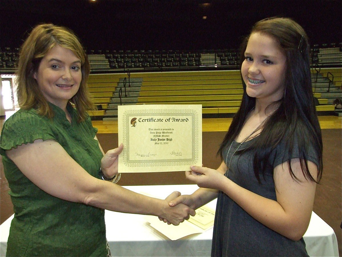 Image: Anna Paige Westbrook — Anna Paige Westbrook is honored with a Certificate of Award from IHS Principal Tanya Parker for being a member of the National Junior Honor Society (NJHS).