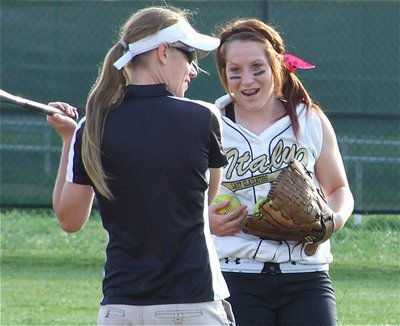 Image: No worries — Coach Jennifer Reeves and Bailey Bumpus share a light moment during warm-ups before the game against Hubbard.