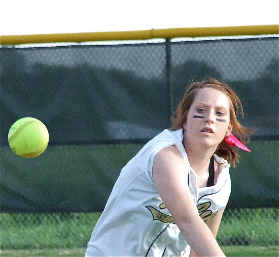 Image: Bailey ball — Bailey Bumpus makes a throw from centerfield.