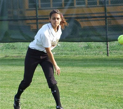 Image: Viers follows thru — Anna Viers works on catching and throwing before the game.