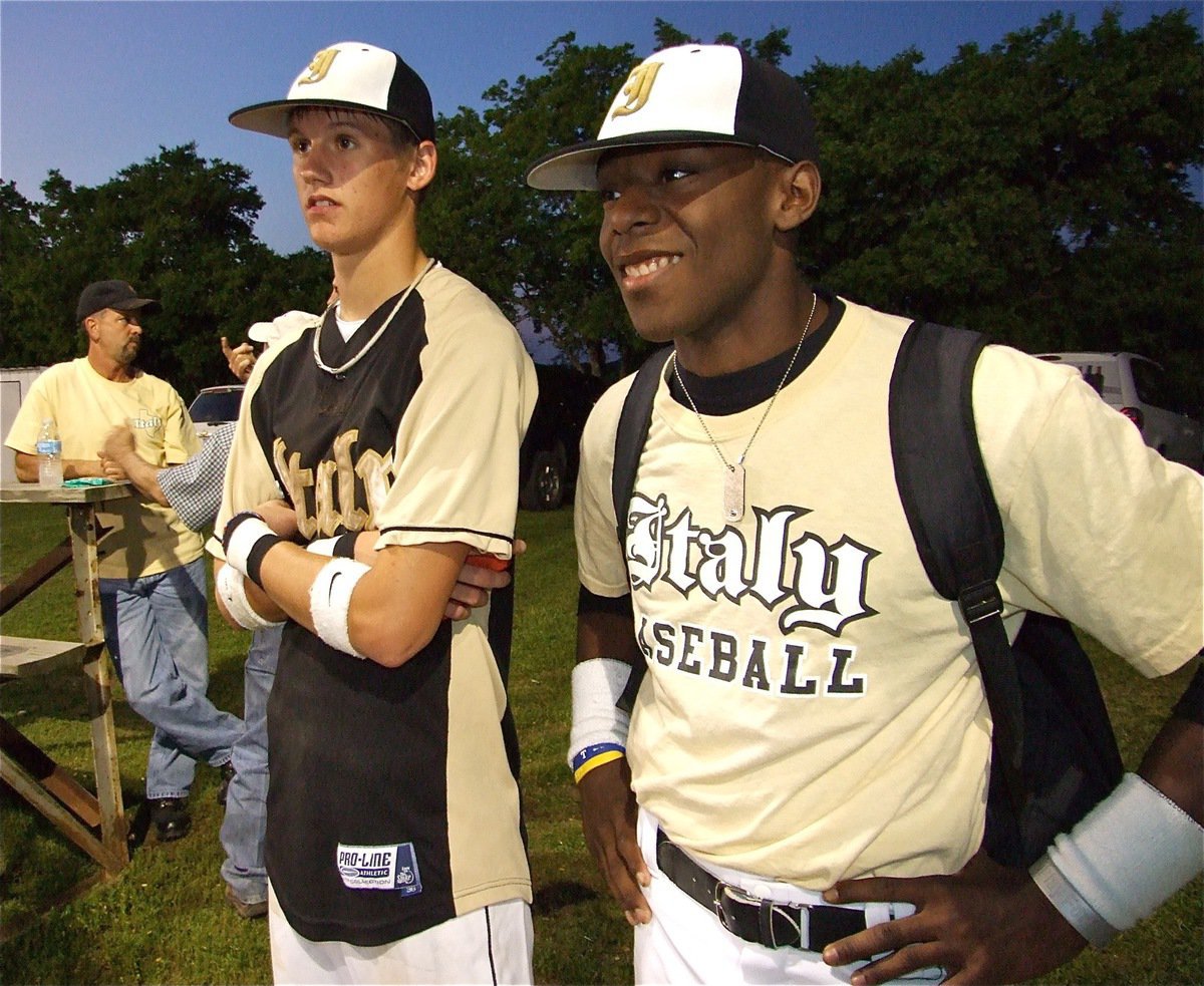 Image: Player support — Jase Holden and Desmond Anderson come by to support their ladies after clinching their district championship 8-1 over Frost.