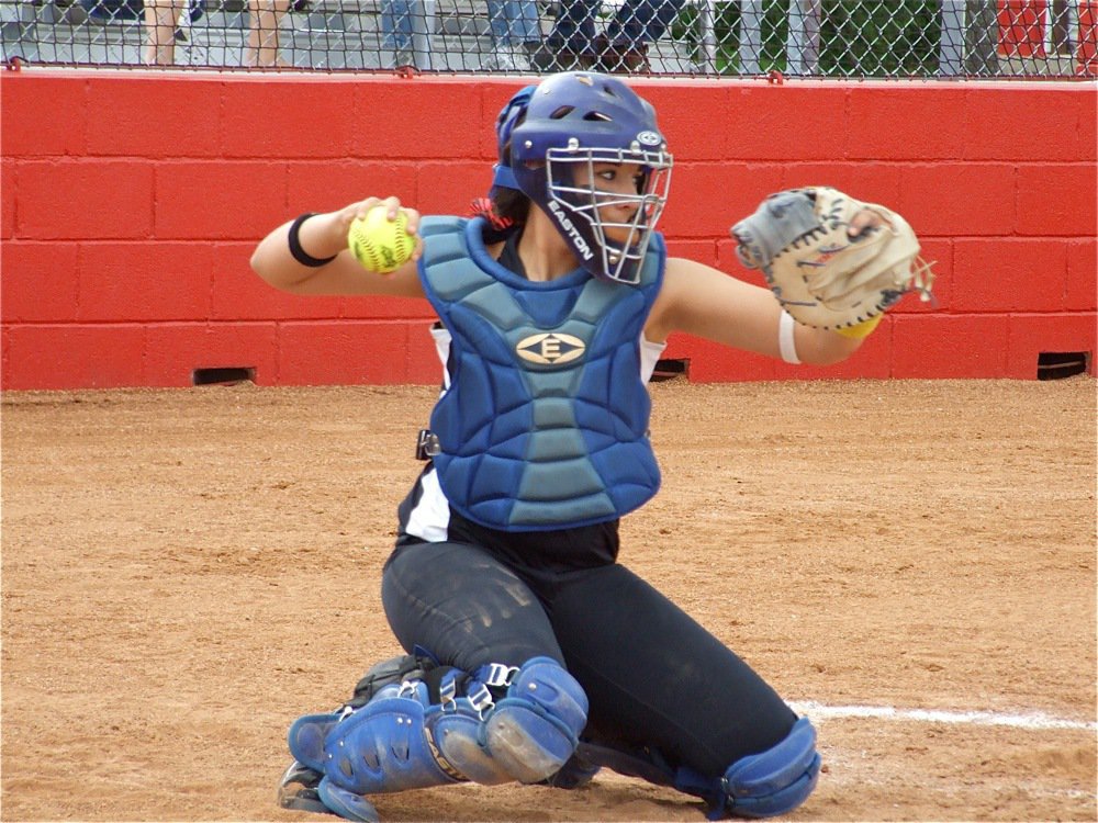 Image: Always dusty — Hard working Lady Gladiator catcher Alyssa Richards is always covered in sand and dust in her photos. Richards warms up her sister Megan Richards who was on the mound against DeLeon.