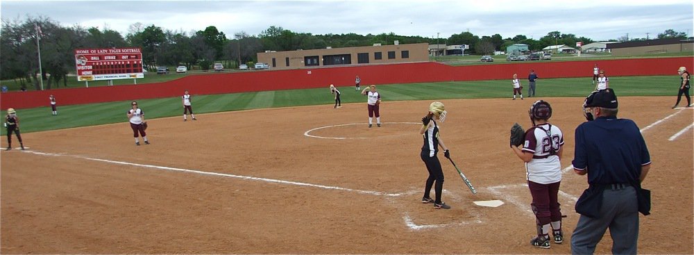 Image: Bases loaded! — With Anna Viers on third, Bailey Bumpus on second and Alyssa Richards on first base, senior Drew Windham battles with the DeLeon pitcher and eventually forces a wild pitch that allows Viers to score from third.