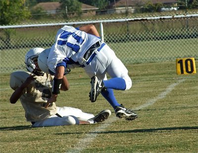 Image: Hip, hip, Jaray! — Italy’s Jaray Anderson(9) pulls down a Blooming Grove runner in the Lions’ backfield.