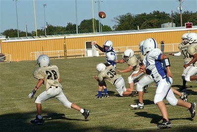 Image: Defense! — Caden Petrey(35) and John Byers(56) force an awkward pass attempt by the Lions that fell incomplete.