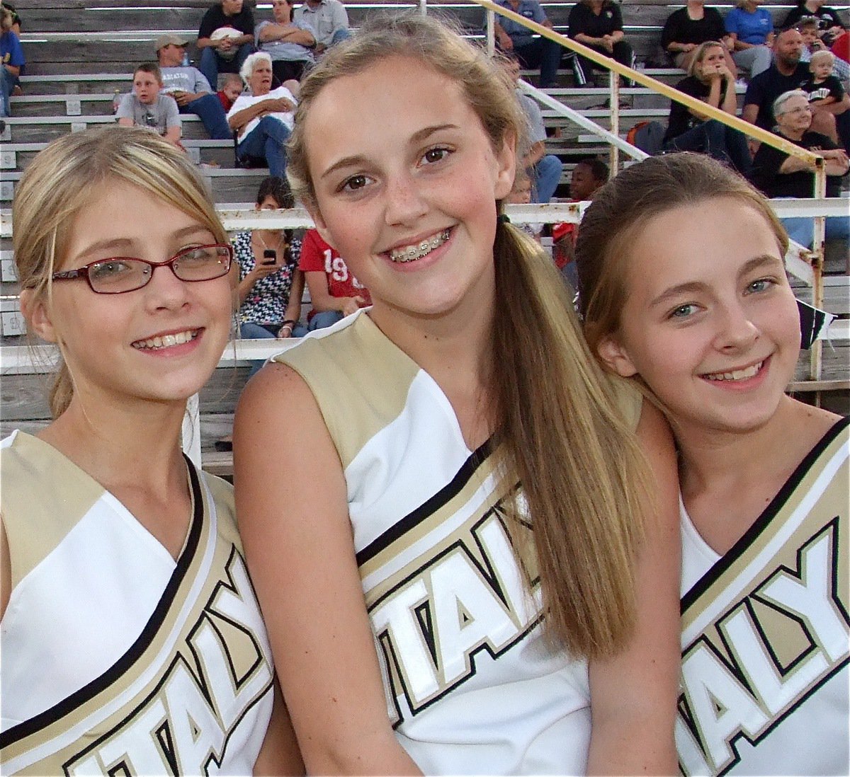 Image: Lean on us — The Gladiators always have their cheerleaders to lean on for support. Haylee Turner, Kelsey Nelson and Brit Chambers are proud of their team.