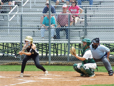Image: Courtney crouches — Courtney Westbrook threatens to bunt against Blue Ridge’s defense.