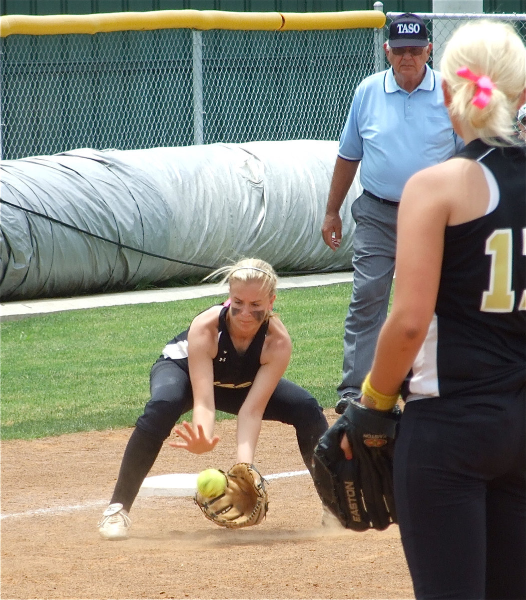 Image: How it’s done! — Courtney Westbrook fields a grounder at third base and then steps on the bag for a force out against Blue Ridge in game three.