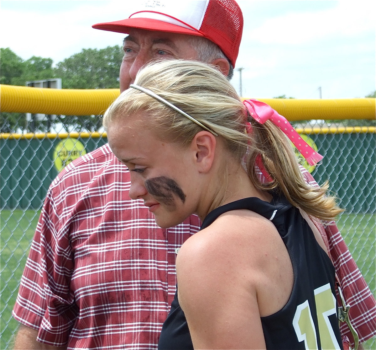 Image: Proud grandad — Senior Courtney Westbrook is comforted by her grandfather after the heartbreaking loss to Blue Ridge.