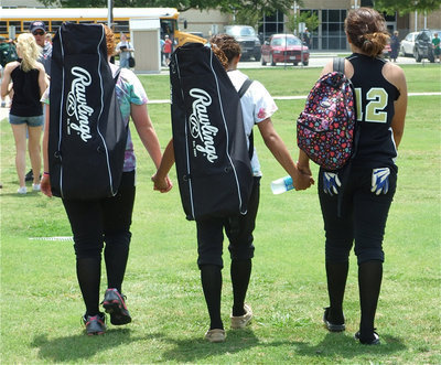 Image: We’ll be back… — Freshmen Katie Byers, Anna Viers and Alyssa Richards leave Forney hand-in-hand with plans of returning to the playoffs again next season.