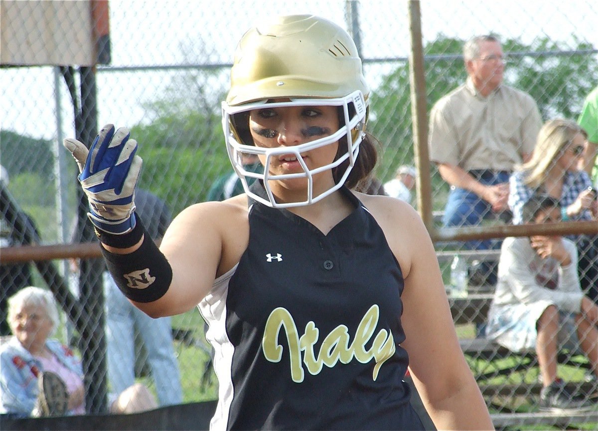 Image: Crank it up! — Alyssa Richards calls for her teammates to crank up the noise from the dugout.