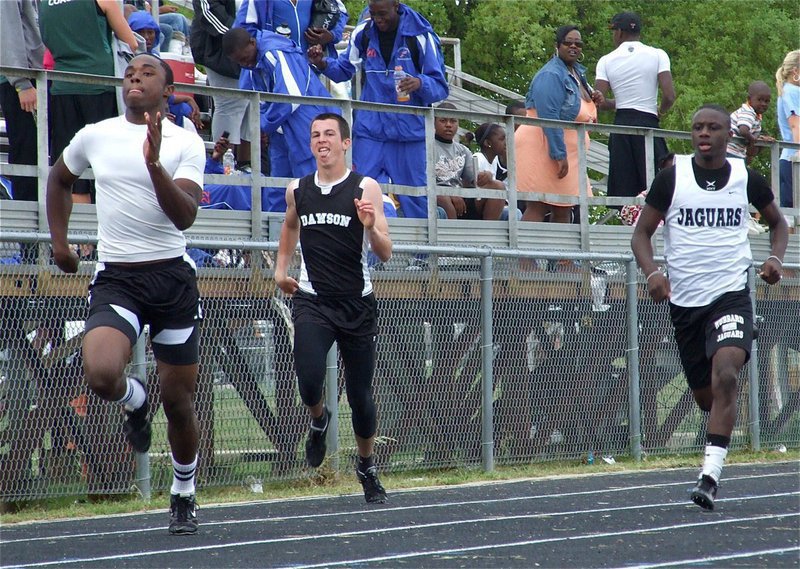 Image: Jasenio “Beast” Anderson being chased by a Bulldog and a Jaguar — Italy’s Jasenio “Beast” Anderson leaves the competition chasing his tail at the district Track Meet in Hubbard.