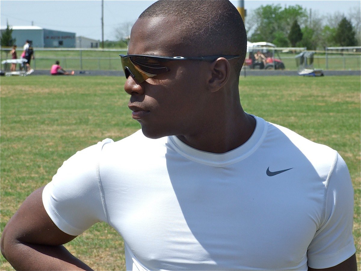 Image: Cool under the sun — Desmond Anderson catches some rays before his relay event.