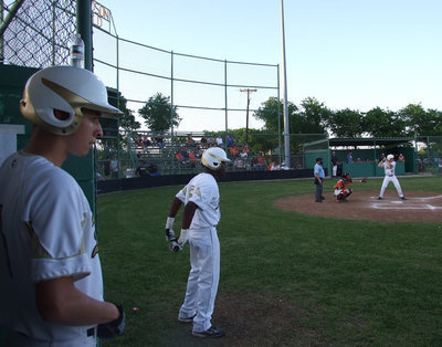 Image: Oscar and Dez — Seniors Oscar Gonzalez and Desmond Anderson wait for Ryan Ashcraft to make his hit.