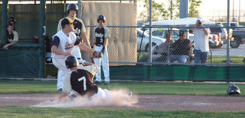 Image: Patterson slides to safety — Trevor Patterson slides into home and adds another run to the scoreboard against the Eagles on Tuesday night.
