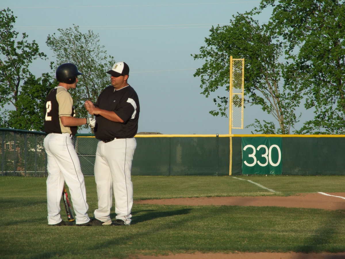 Image: Coach Coker — Coach gives Ryan Ashcraft a few pointers.