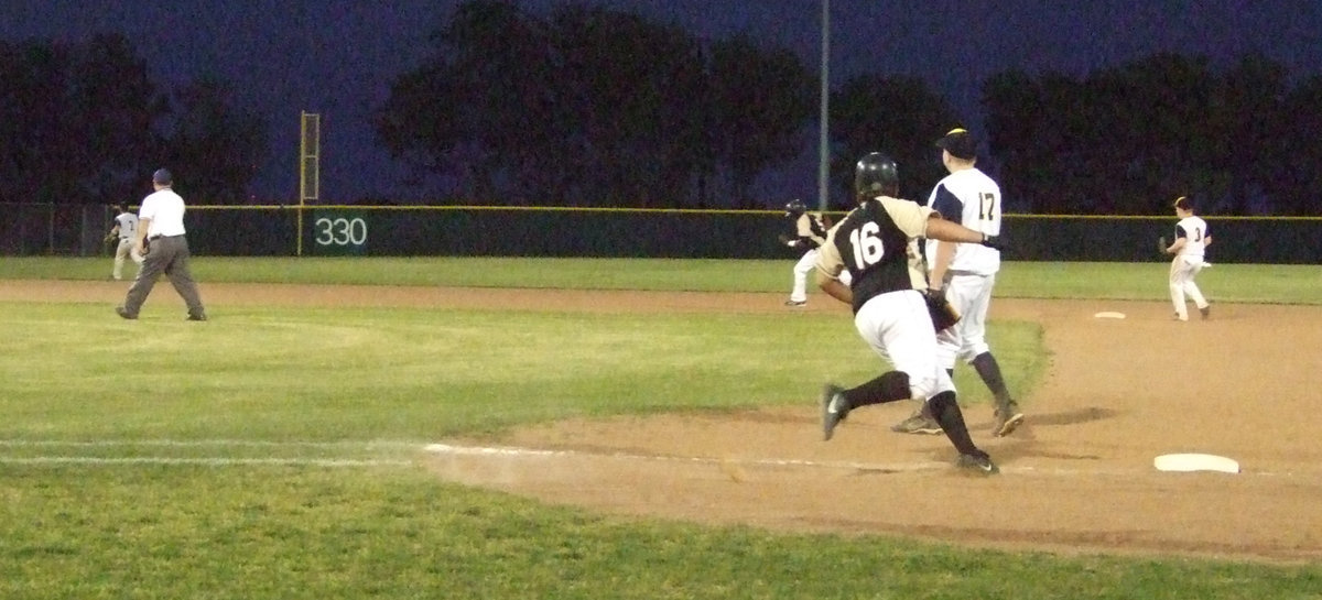 Image: Ivan runs for his life — Senior Ivan Roldan checks out Desmond Anderson on second.