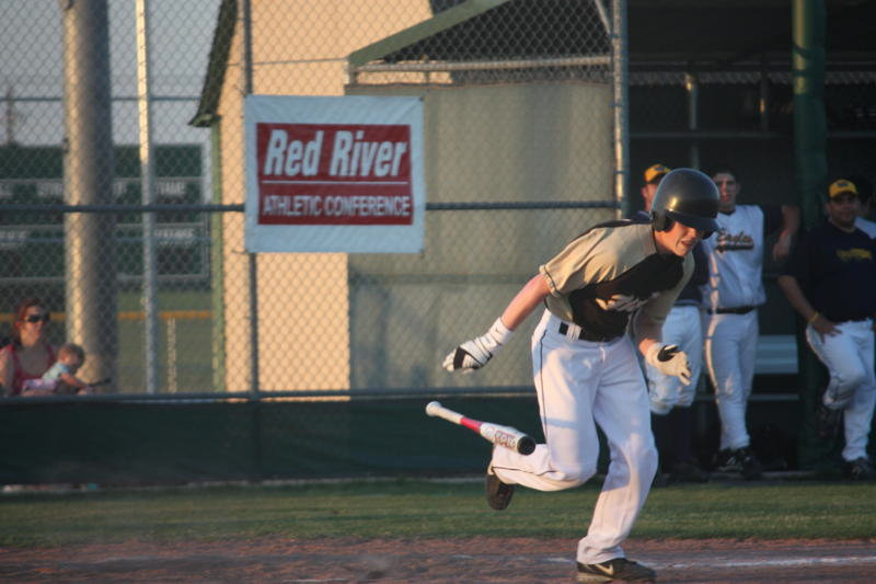 Image: Buck can bunt — Justin Buchanan works off a bunt.