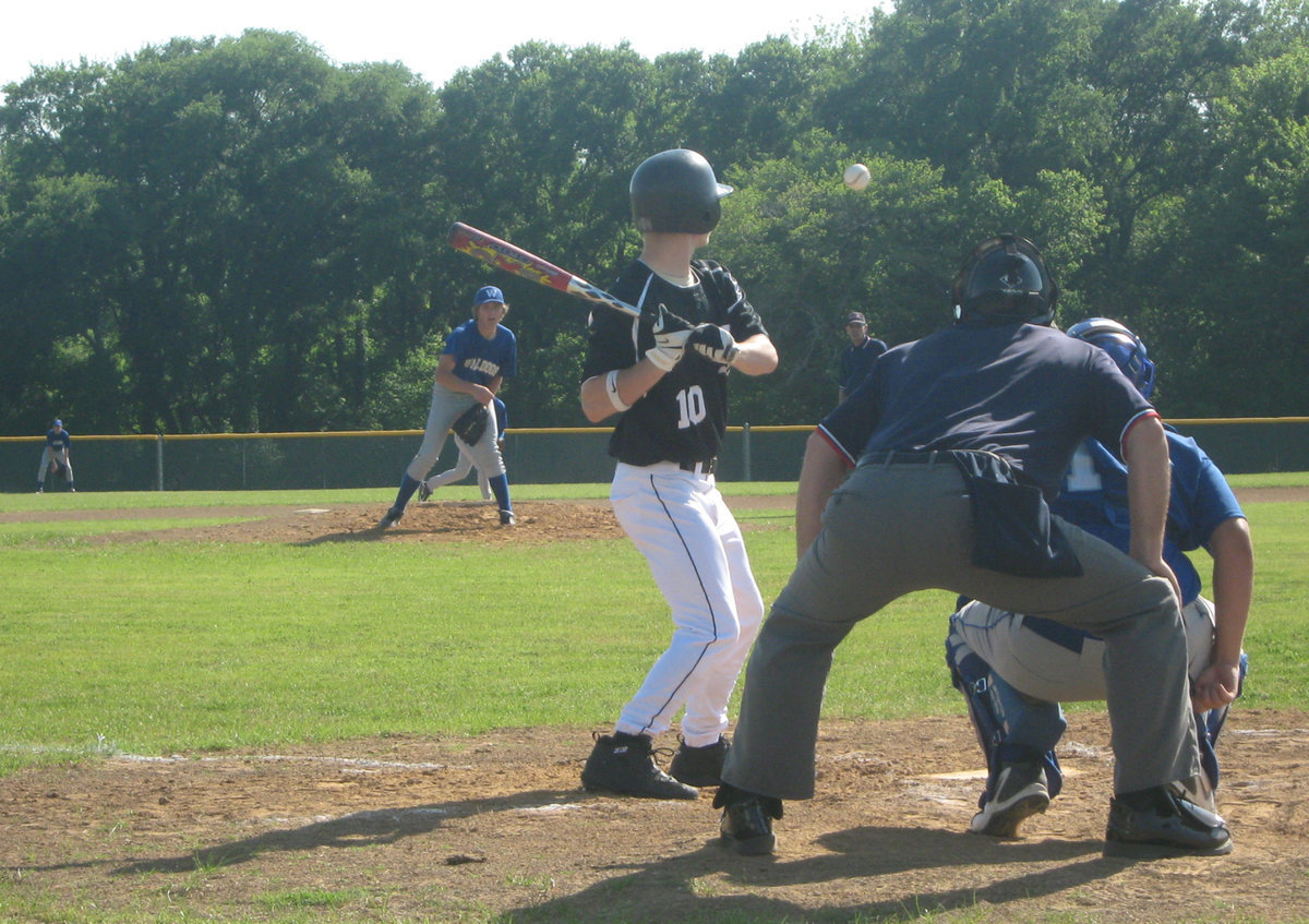 Image: Hamilton stands ready — Chase Hamilton watches the ball as Wortham pitches at the plate.