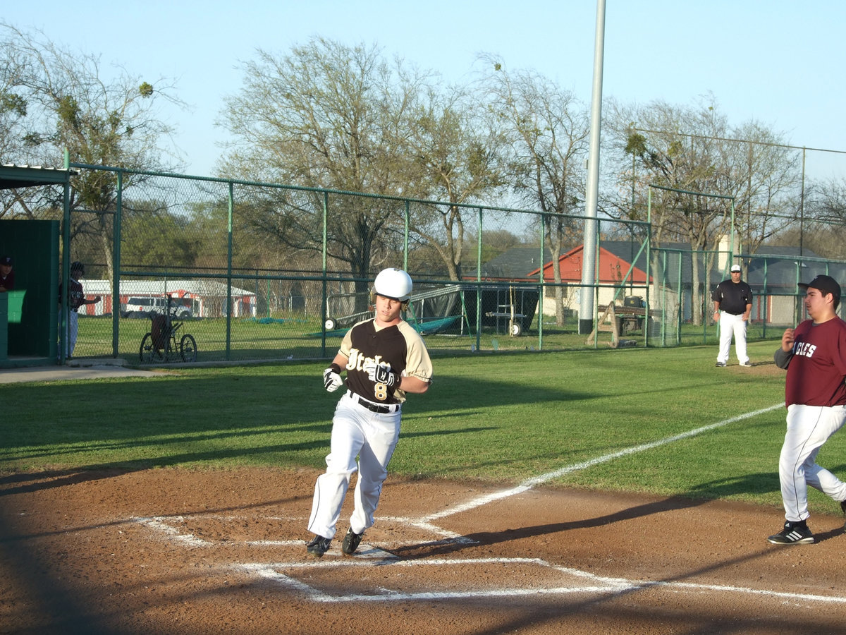 Image: Josh gives us another one — Senior Josh Milligan tears around the bases and completes his journey.