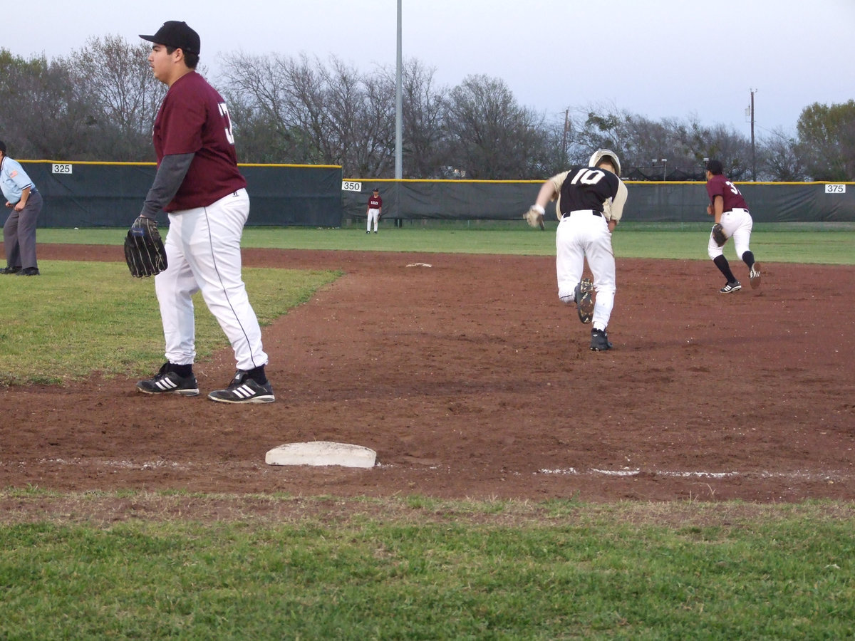 Image: Go Chase — After several attempts to steal, Chase Hamilton forges through.