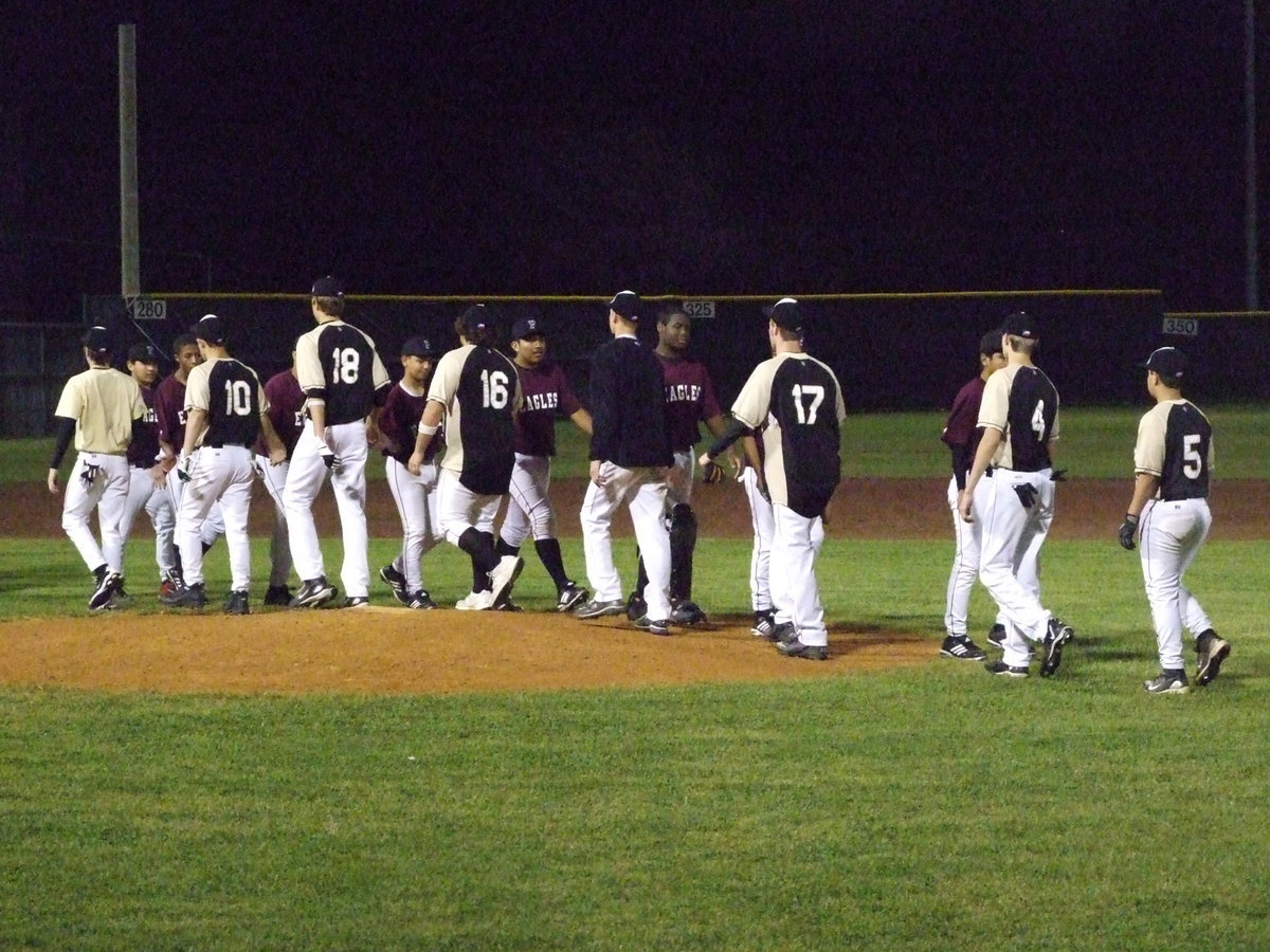 Image: Good sports — Gladiators and Eagles shake hands after the game.