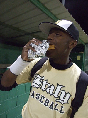 Image: Desmond can eat — Desmond Anderson wants to let everyone know the best hamburger in town is at the concession stand during the ball games.
