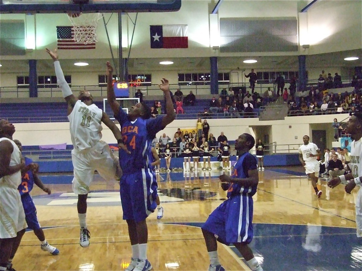 Image: Floating On Air — Jasenio Anderson(11) and his teammates were floating on air after winning the hard fought regional quarterfinal championship game over Gateway.