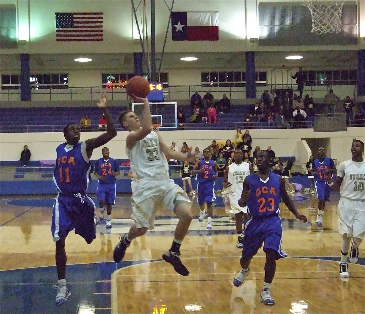 Image: Jase leaps ahead — Jase Holden(33) leaps toward the basket for a score.