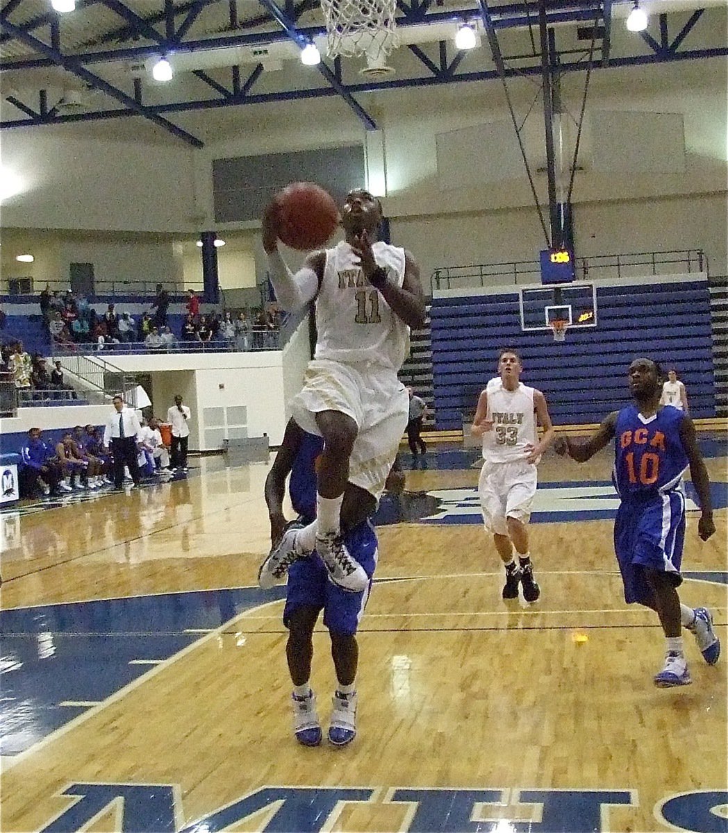 Image: All night long — This was a common sight Monday as Jasenio Anderson(11) did his damage at the rim.