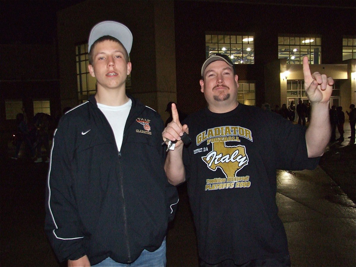 Image: Parking lot pride — Kyle Jackson, a member of the Italy J.V. Basketball Team this season, and his dad were  proud of the varsity Gladiators after the game.