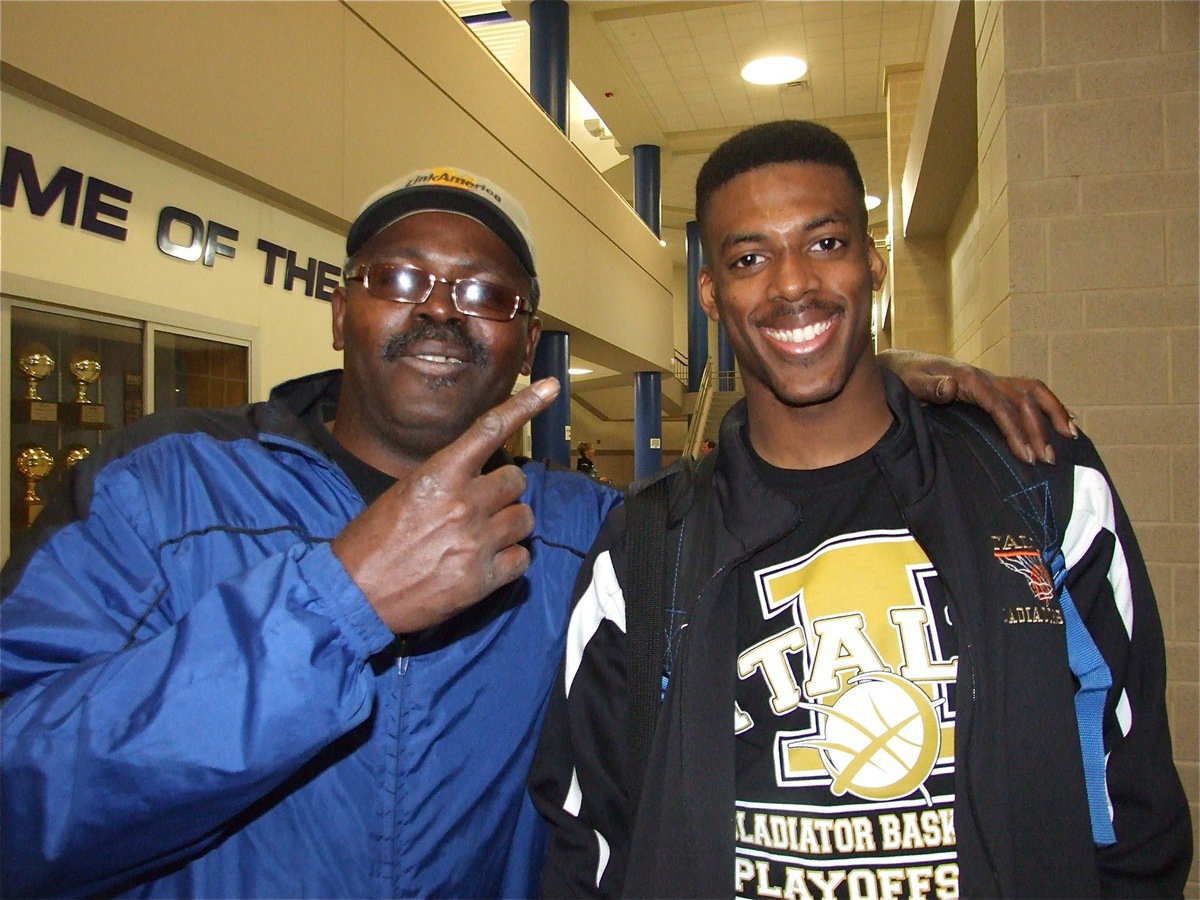 Image: Happy 18th, John! — John Isaac celebrates his 18th Birthday with his dad with a 19-point performance and a win over Gateway in the regional quarterfinal championship.